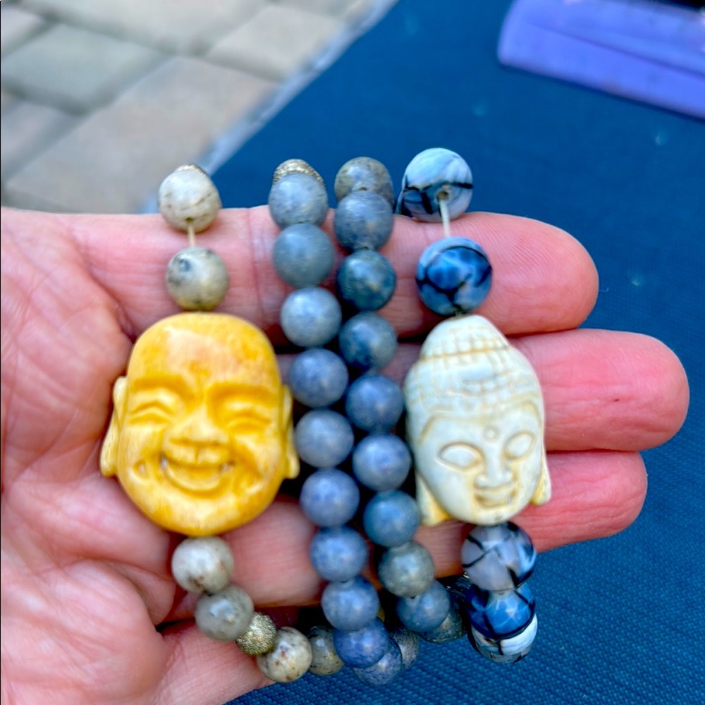 Set of four hand beaded blue Buddha bracelets